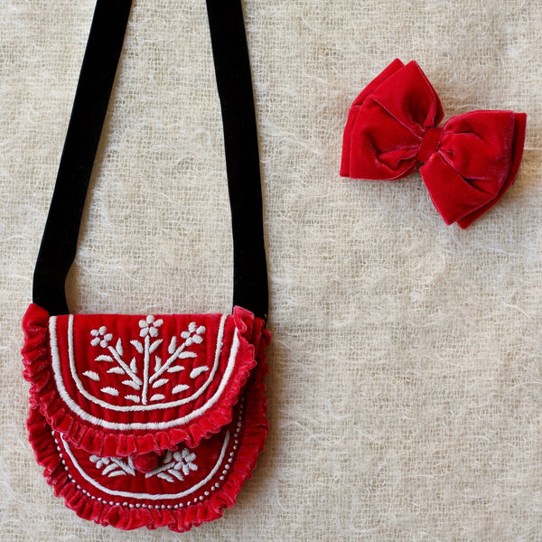 Embroidered bag and red velvet hair bow