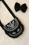 Embroidered bag and black velvet hair bow