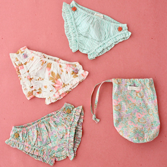Set of 3 panties sold in a small pastel garden bag